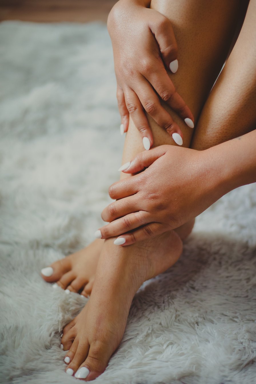 Persons Feet on White Sand